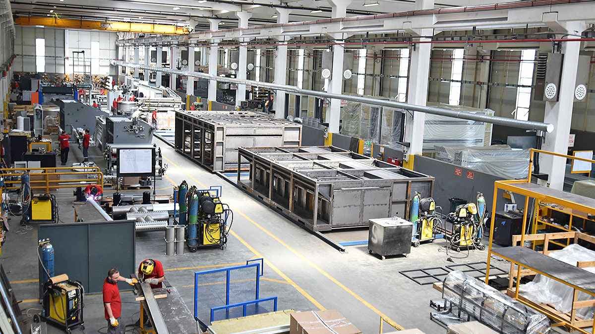 Industrial machinery and fixed assets on a manufacturing floor, representing enterprise asset control